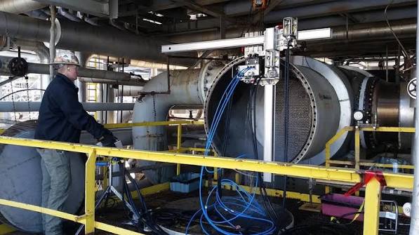 Craftsman welding a large pipe spool